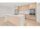 The modern kitchen is equipped with stainless steel appliances, a stylish island, and trendy light fixtures at 1050 55Th S Ave, St Petersburg, FL 33705