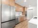 The stainless steel refrigerator complements the modern oven and range in this well-appointed kitchen at 1050 55Th S Ave, St Petersburg, FL 33705