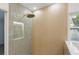 Modern shower featuring grey tile and a rain showerhead at 1050 55Th S Ave, St Petersburg, FL 33705