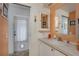 Well-lit bathroom featuring a vanity with countertop space and convenient door at 1110 49Th Avenue W Dr, Bradenton, FL 34207
