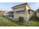 A quaint home featuring neutral tones, complemented by well-maintained landscaping and a cozy screened in area at 1110 49Th Avenue W Dr, Bradenton, FL 34207