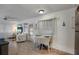 Living room with views of the outdoors and an adjacent dining area at 1110 49Th Avenue W Dr, Bradenton, FL 34207