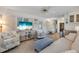 Open-concept living area features a flat-screen TV and comfortable seating arrangements at 1110 49Th Avenue W Dr, Bradenton, FL 34207