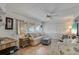 Comfortable living room with large windows, blinds, and stylish furnishings at 1110 49Th Avenue W Dr, Bradenton, FL 34207