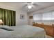 Spacious main bedroom features a ceiling fan, natural light, and ample space at 1110 49Th Avenue W Dr, Bradenton, FL 34207