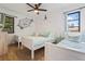 Bright and stylish bedroom featuring three twin beds and nautical decor at 11219 93Rd St, Largo, FL 33773