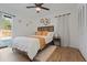 Bedroom featuring modern furnishings and outdoor access to the pool area at 11219 93Rd St, Largo, FL 33773