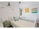 Charming bedroom featuring twin beds, nautical decor, and bright artwork at 11219 93Rd St, Largo, FL 33773
