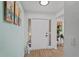 Inviting front entry with modern decor and ample lighting at 11219 93Rd St, Largo, FL 33773