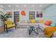 Bright living room with colorful artwork, modern decor, and a comfortable sectional sofa at 11219 93Rd St, Largo, FL 33773