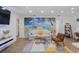 Comfortable living room with modern decor, beach-themed mural, and stylish furnishings at 11219 93Rd St, Largo, FL 33773