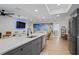 Bright open concept kitchen and living area with modern appliances and stylish furnishings at 11219 93Rd St, Largo, FL 33773