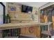 Covered outdoor bar with stools and lighting offers plenty of entertainment options at 11219 93Rd St, Largo, FL 33773