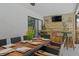 Covered outdoor bar and dining area with seating for ten, and a convenient passthrough to the kitchen at 11219 93Rd St, Largo, FL 33773