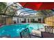 Enjoy this in-ground pool area with outdoor grilling, dining, and lounging at 11219 93Rd St, Largo, FL 33773