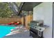 Private screened-in pool area with lounge chairs and a built-in grill at 11219 93Rd St, Largo, FL 33773