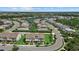 Aerial view showcases an upscale residential community with a lake, clubhouse and well-manicured landscaping at 12029 Cranston Way, Lakewood Ranch, FL 34211