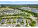 Aerial view of homes in a lakeside community with a circle highlighting the property for sale at 12592 Ryegrass Loop, Parrish, FL 34219