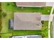Aerial view of a well manicured lawn with a screened in patio with furniture at 12592 Ryegrass Loop, Parrish, FL 34219