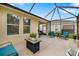 Spacious screened patio with outdoor furniture and a view of the backyard at 12592 Ryegrass Loop, Parrish, FL 34219
