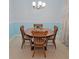 Cozy dining room featuring an elegant chandelier, a classic wooden table, and decorative details at 12809 7Th Ne Ave, Bradenton, FL 34212