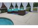 Spacious pool deck with comfortable seating, a modern coffee table, and stylish decorative accents at 12809 7Th Ne Ave, Bradenton, FL 34212