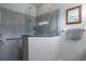 Modern bathroom showcasing a glass shower with stylish gray tile, a safety bar, and a framed picture at 1322 Millbrook Cir, Bradenton, FL 34212