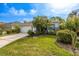 Lovely single-Gathering home featuring a pristine lawn and mature landscaping at 1322 Millbrook Cir, Bradenton, FL 34212