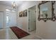 Bright foyer with tile flooring, a chandelier, and an ornate mirror at 1322 Millbrook Cir, Bradenton, FL 34212