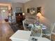 Cozy living room featuring hardwood floors, a patterned sofa, and decorative wall art at 1322 Millbrook Cir, Bradenton, FL 34212