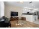 Open-concept living area seamlessly connects the living room with a modern kitchen at 1322 Millbrook Cir, Bradenton, FL 34212