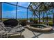 Screened-in patio featuring a hot tub with views of the water at 1322 Millbrook Cir, Bradenton, FL 34212