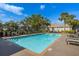 Sparkling community pool with comfortable seating area, ideal for enjoying sunny days and relaxation at 1322 Millbrook Cir, Bradenton, FL 34212