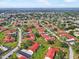 Aerial view of a residential neighborhood featuring red roofs and lush greenery at 1421 57Th W St # 1421, Bradenton, FL 34209