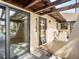 Comfortable screened in porch leading to the residence's sliding glass doors at 1421 57Th W St # 1421, Bradenton, FL 34209