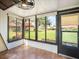 Enclosed lanai boasting tile floors, a ceiling fan, and large windows providing scenic views at 1421 57Th W St # 1421, Bradenton, FL 34209