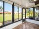 Enclosed lanai with tile floors, a ceiling fan, and lots of windows providing nice views at 1421 57Th W St # 1421, Bradenton, FL 34209