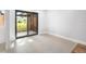 Bright room featuring tile flooring, with sliding glass doors leading to the exterior at 1421 57Th W St # 1421, Bradenton, FL 34209