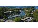 Aerial view of a well-maintained marina with boats docked in a scenic waterfront community at 1720 Glenhouse Dr # Gl430, Sarasota, FL 34231