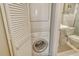 Space saving bathroom with stackable washer/dryer and modern toilet and sink at 1720 Glenhouse Dr # Gl430, Sarasota, FL 34231
