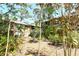 Exterior of multi Gathering home showcasing outdoor staircases and lush tropical landscaping at 1720 Glenhouse Dr # Gl430, Sarasota, FL 34231