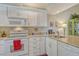 Well-equipped kitchen with modern appliances, ample cabinet space, and granite counters at 1720 Glenhouse Dr # Gl430, Sarasota, FL 34231