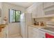 Efficient kitchen featuring white appliances, plenty of counter space, and natural light at 1720 Glenhouse Dr # Gl430, Sarasota, FL 34231
