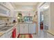 Open concept kitchen with eat-in counter overlooks the living and dining areas at 1720 Glenhouse Dr # Gl430, Sarasota, FL 34231