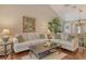 Spacious living room offering plush sofas, stylish decor, and a cozy atmosphere at 1720 Glenhouse Dr # Gl430, Sarasota, FL 34231