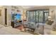 Bright living room with hardwood floors, a sliding glass door to porch, and comfortable seating at 1720 Glenhouse Dr # Gl430, Sarasota, FL 34231