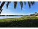 Scenic view of a body of water with small islands surrounded by tropical landscaping on a sunny day at 1720 Glenhouse Dr # Gl430, Sarasota, FL 34231