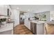 Bright kitchen with stainless appliances, an island with a breakfast bar, and an open layout at 1738 Cobb Trl, Parrish, FL 34219