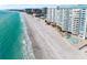 Stunning aerial view of the beachfront condos and pristine white sand beach at 1750 Benjamin Franklin Dr # 6B, Sarasota, FL 34236