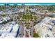 Aerial view of a roundabout with traffic and a park, surrounded by buildings in a city at 1750 Benjamin Franklin Dr # 6B, Sarasota, FL 34236
